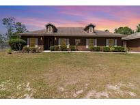 Charming single-story home with well-maintained landscaping and a spacious front lawn at 5242 Bancroft Blvd, Orlando, FL 32833