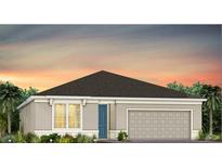 Charming single-story home with a two-car garage and landscaped front yard at sunset at 5517 Flame Vine Way, St Cloud, FL 34771