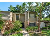Charming townhome featuring a well-manicured lawn and inviting front entrance at 487 Oak Haven Dr # 487, Altamonte Springs, FL 32701