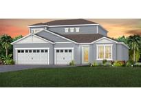 Charming two-story home with a three-car garage and well-manicured lawn at 16316 Crown Top Dr, Montverde, FL 34756