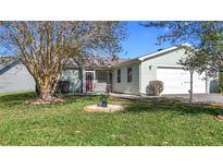 Charming single-story home with well-manicured lawn and attached one car garage at 840 Cortez Ave, The Villages, FL 32159