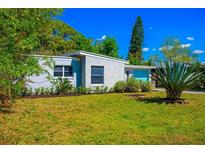 Charming home featuring a well-maintained lawn and a striking agave plant at 2501 Weber St, Orlando, FL 32803