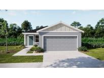 Charming single-story home showcasing a well-manicured lawn and an attached two-car garage at 5543 Maddie Dr, Haines City, FL 33844
