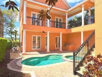 Inviting backyard oasis featuring a refreshing swimming pool and spa, perfect for relaxation and entertainment at 1554 Corolla Ct, Reunion, FL 34747