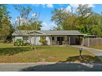 Charming single-story home with a well-maintained lawn and covered porch at 314 Avalone Dr, Apopka, FL 32703