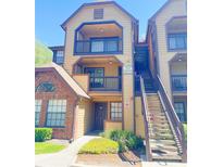 Inviting two-story condo with balconies, traditional architecture, and well-maintained landscaping at 315 Lakepointe Dr # 201, Altamonte Springs, FL 32701