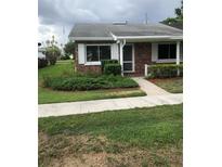 Charming brick home with a well-manicured lawn and landscaping at 769 Avenue Q Se, Winter Haven, FL 33880