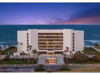 Elegant condo building boasting ocean views, lush landscaping, and convenient underground parking at 901 S Atlantic Ave # 3, Ormond Beach, FL 32176