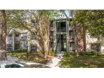 Inviting condo complex with lush landscaping and charming architectural details at 5136 Park Central Dr # 212, Orlando, FL 32829