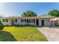 Charming single-story home with a well-maintained lawn and neutral exterior paint at 5379 Botany Ct, Orlando, FL 32811