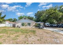 Charming single-story home with a stucco exterior and a well-maintained front yard at 1056 Pinder St, Deltona, FL 32725