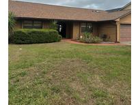 Charming single-story home with well-maintained landscaping and inviting front entrance at 277 South St, Fern Park, FL 32730