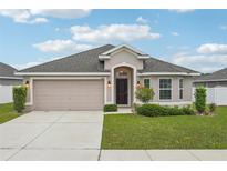 Charming single-story home with a two-car garage and a well-manicured front yard at 1846 Galloway Ter, Winter Haven, FL 33881