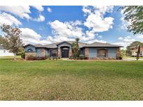Charming single story home with mature landscaping and stone accents create curb appeal at 4037 Se 40Th St, Ocala, FL 34480