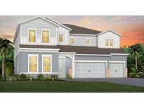 Stunning two-story home with a three-car garage and charming architectural details at 4709 Flagstaff Ct, Orlando, FL 32820