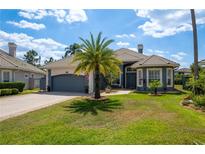 Charming single-Gathering home boasts a well-manicured lawn and lovely landscaping, including a palm tree at 10662 Woodchase Cir, Orlando, FL 32836