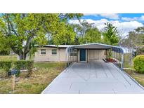 Charming single-story home with a covered carport and well-maintained front yard at 1805 Knox Ave, Sanford, FL 32771