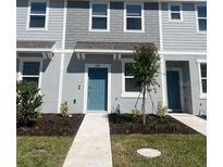 New construction townhome features light blue siding and a small front yard with new landscaping at 2081 Viewfinder St, Kissimmee, FL 34758