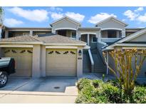 Charming two-story condo featuring a two-car garage and well-maintained landscaping at 9423 Myrtle Creek Ln # 510, Orlando, FL 32832