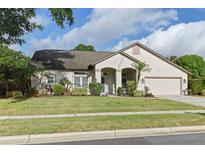 Charming single-story home with well-manicured lawn and tasteful landscaping at 4353 Steed Ter, Winter Park, FL 32792