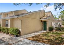 Inviting home featuring manicured landscaping and a charming entranceway, perfect for a cozy and welcoming curb appeal at 5395 Emerald Isle Drive # 1011, Orlando, FL 32812