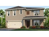 Charming two-story home with a two-car garage and well-maintained landscaping in a desirable neighborhood at 1222 Alstonia Ln, Mount Dora, FL 32757