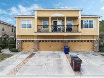 Charming multi-Gathering home featuring a second-story balcony and attached garages at 2256 Betsy Ross Ln, St Cloud, FL 34769