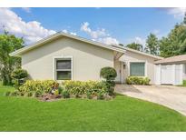 Charming single-story home with manicured lawn and lush landscaping at 5345 Sunrise Blvd, Orlando, FL 32803