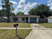Charming single-story home features a well-manicured lawn and a convenient one-car garage at 871 Darwin Dr, Altamonte Springs, FL 32701