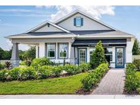 Charming single-story home with well-manicured landscaping, and covered entryway at 2547 Great Heron Ave, St Cloud, FL 34773
