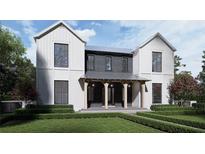 Striking two-story home featuring light siding and dark accents, with a covered front porch and manicured landscaping at 1250 Water Maple Dr, Oakland, FL 34787