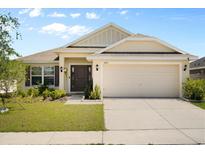 Charming single-Gathering home featuring a well-manicured lawn and attached two-car garage in a desirable neighborhood at 1645 Denali St, Davenport, FL 33837