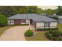 Charming single-story home features a well-manicured lawn and inviting curb appeal at 2100 Shirewood Ct, Winter Park, FL 32792