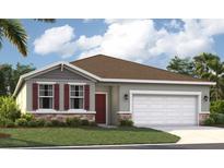Charming single-Gathering home with a well-manicured lawn, two car garage, and red shutters at 9161 Harris Hawk Dr, Leesburg, FL 34788