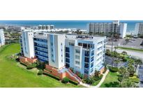 Beautiful condo building with blue accents and manicured landscaping near the beach at 5300 S Atlantic Ave # 2-505, New Smyrna Beach, FL 32169