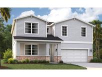 Charming two-story home featuring shaker siding and a welcoming front porch, with stone accents and a two car garage at 9153 Harris Hawk Dr, Leesburg, FL 34788