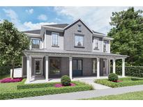 Charming two-story home with a covered porch, manicured landscaping, and gray accents at 1244 Water Maple Dr, Oakland, FL 34787