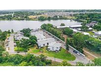 Waterfront condos with well-maintained green spaces, parking, and lake access offers a tranquil setting at 1550 11Th Ne St # H-4, Winter Haven, FL 33881