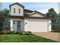 Charming two-story home features a two-car garage, neutral color palette, and beautifully landscaped front yard at 1908 Archer Dr, Minneola, FL 34715