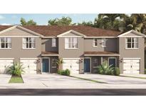 Charming townhome with a two-car garage and lush tropical landscaping at 2903 Canary Ave, Davenport, FL 33837