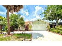Charming single-Gathering home with a two-car garage and a beautifully landscaped front yard at 329 Kantor Blvd, Casselberry, FL 32707