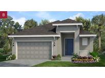 Charming one-story home featuring a two-car garage, neutral paint, and a well-manicured lawn at 503 Silver Palm Dr, Haines City, FL 33844