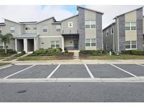 Well-maintained townhomes with ample parking and neatly manicured landscaping at 1036 Leader Street, Davenport, FL 33896