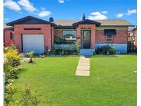 Charming brick home with a well-maintained lawn and inviting front entrance at 340 Zelda Blvd, Daytona Beach, FL 32118