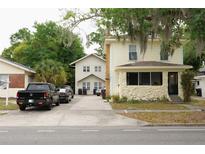 Charming building featuring two different apartments with ample parking and inviting curb appeal at 415 N Fern Creek Ave, Orlando, FL 32803