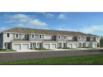 Charming townhomes with attached garages, green grass, and lovely landscaping at 3527 Mayfair St, Kissimmee, FL 34758