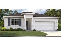 Charming single-story home with neutral color palette, well-manicured lawn and attached garage at 403 Shoreview Sands Ave, Mascotte, FL 34753