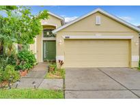 Charming one-story home with well-maintained lawn and a two-car garage in a lovely neighborhood at 4729 Spindletree Ln, Orlando, FL 32829