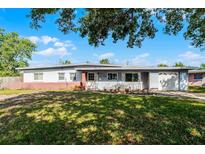 Charming single-story home with a well-maintained front yard, attached garage, and inviting entrance at 5402 Kingswood Dr, Orlando, FL 32810