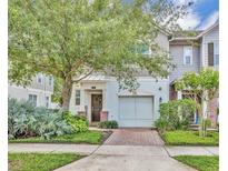Charming townhome with inviting front porch and lush landscaping at 58 Zamora Pl, Oviedo, FL 32765